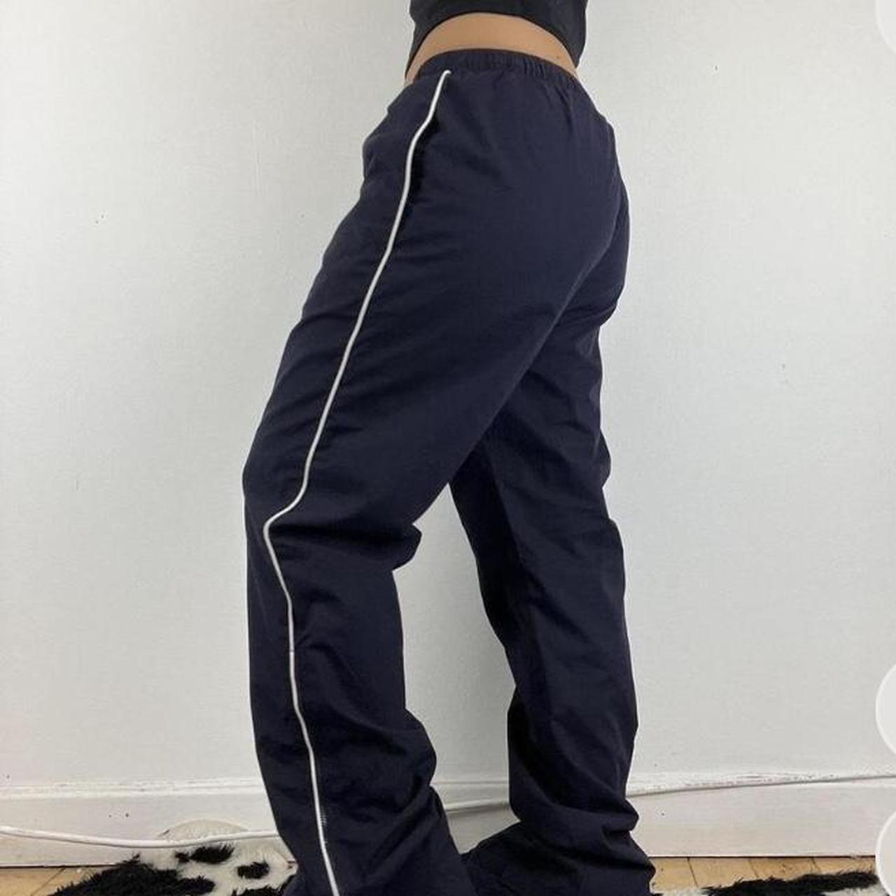 Navy vintage trackies with white stripe down each... - Depop