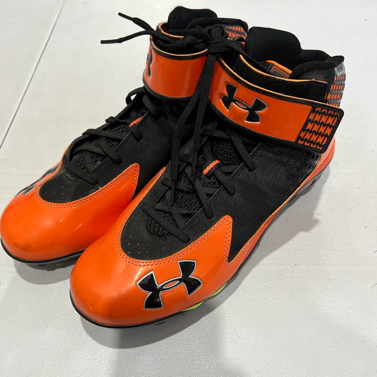 Under armour football on sale cleats orange and black