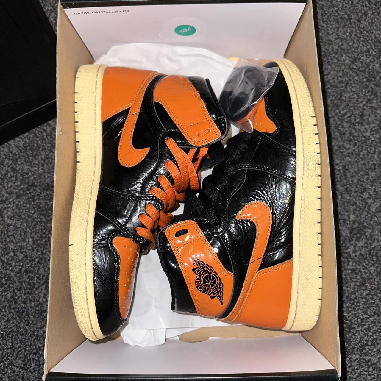 orange and black jordan 1 shattered backboard