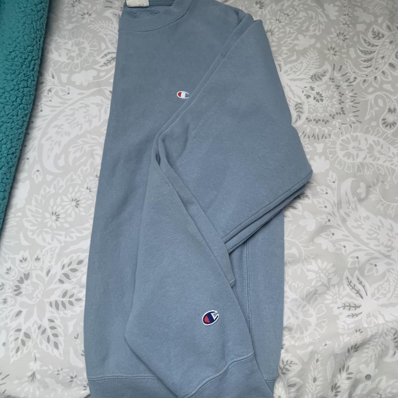 light blue champion jumper used- great condition... - Depop