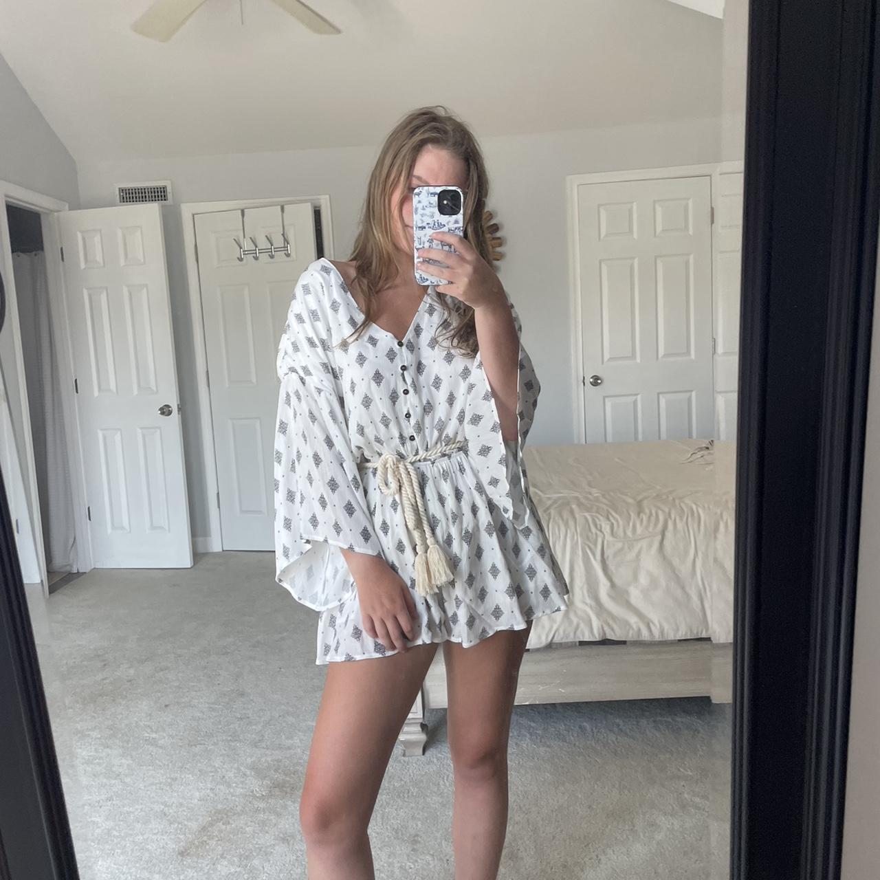 White Romper with a dark grey design and an off... - Depop