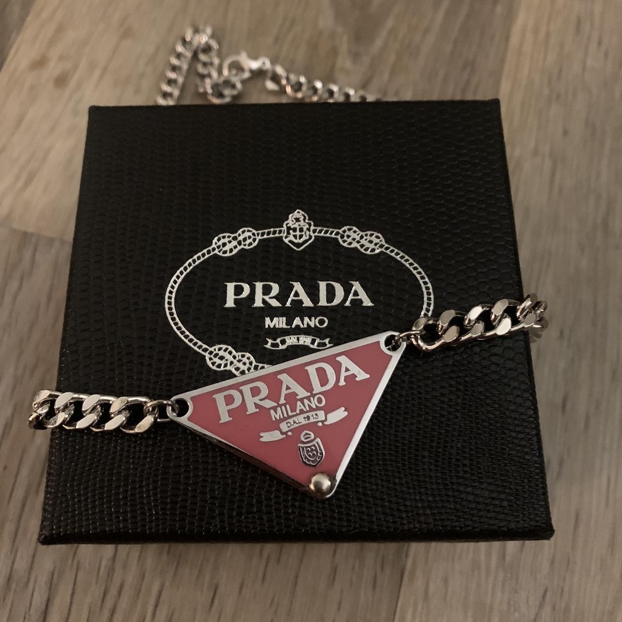 Pink and silver Prada badge Necklace Made from non... - Depop