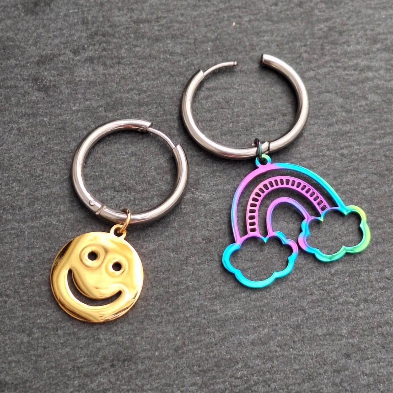 EMOJI EARRINGS. A gold tone smile face and a cutout... Depop
