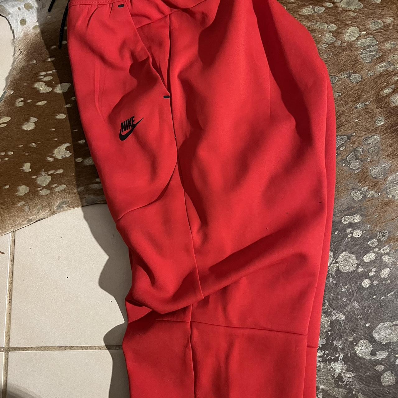 Red nike tech discount bottoms