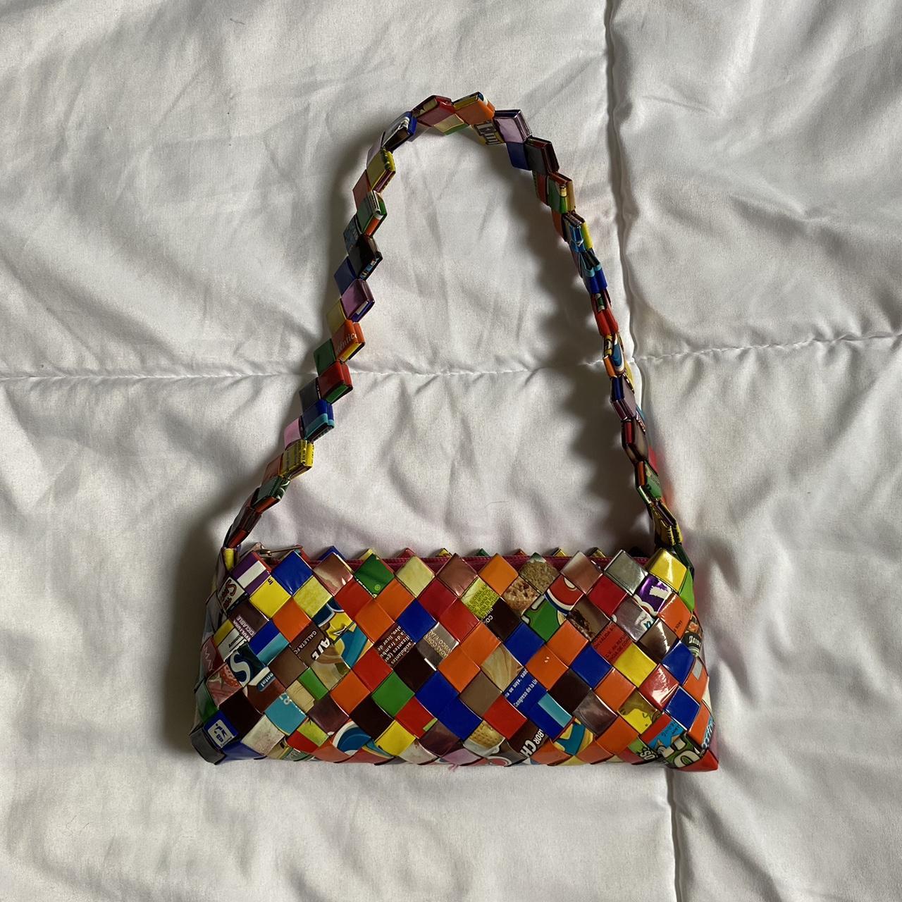 Such a cool purse made out of mylar wrappers, candy, juices, you name they  have folded it and weaved it into purses. I WONDERFUL surprise from my son  for my bi…