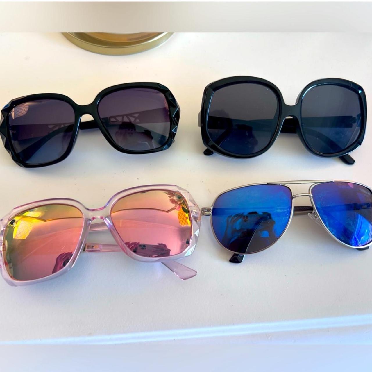 Bundle of pairs of sunglasses are