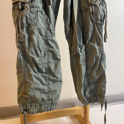 Army green low waisted cargo pants. Drawstring and - Depop