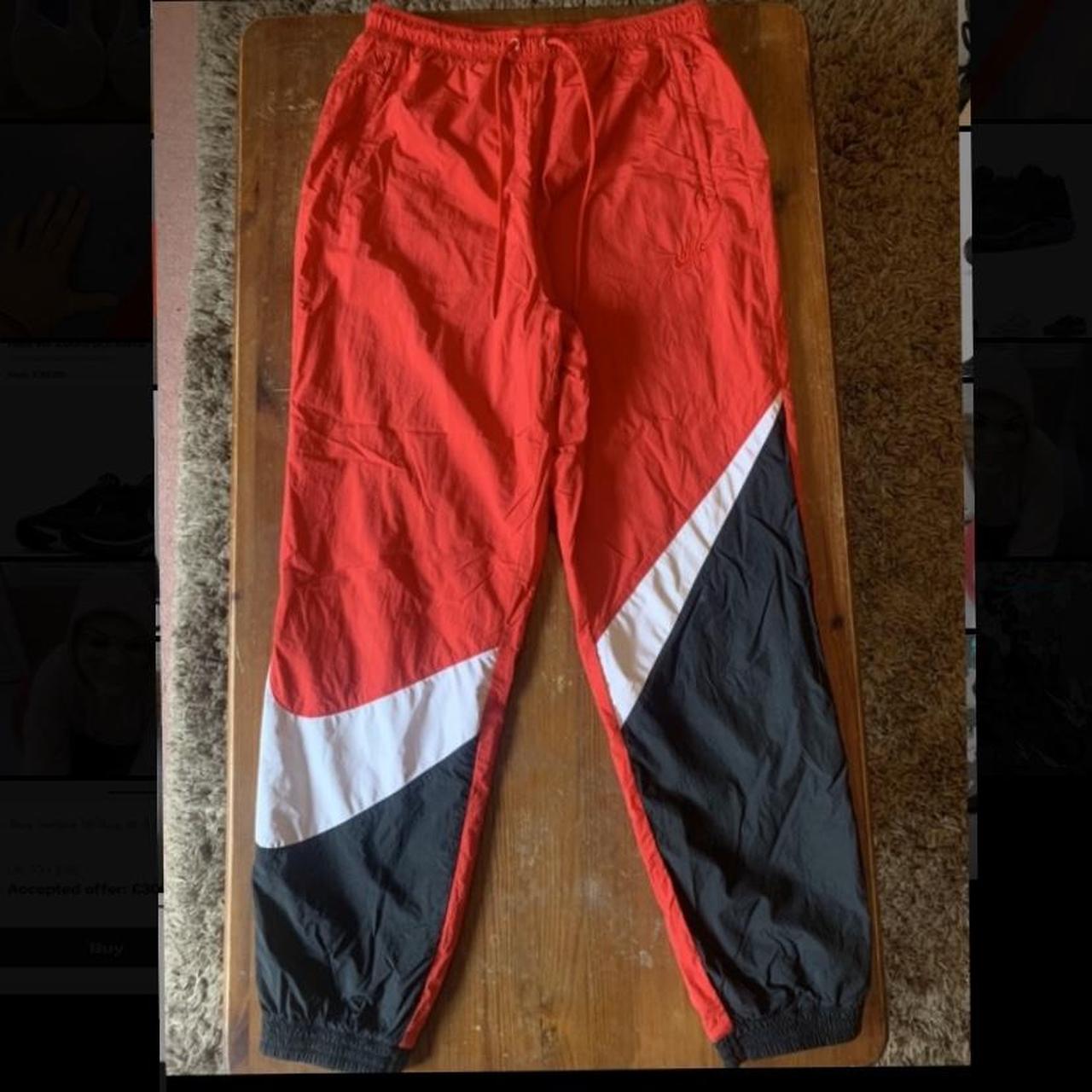 red nike swoosh joggers