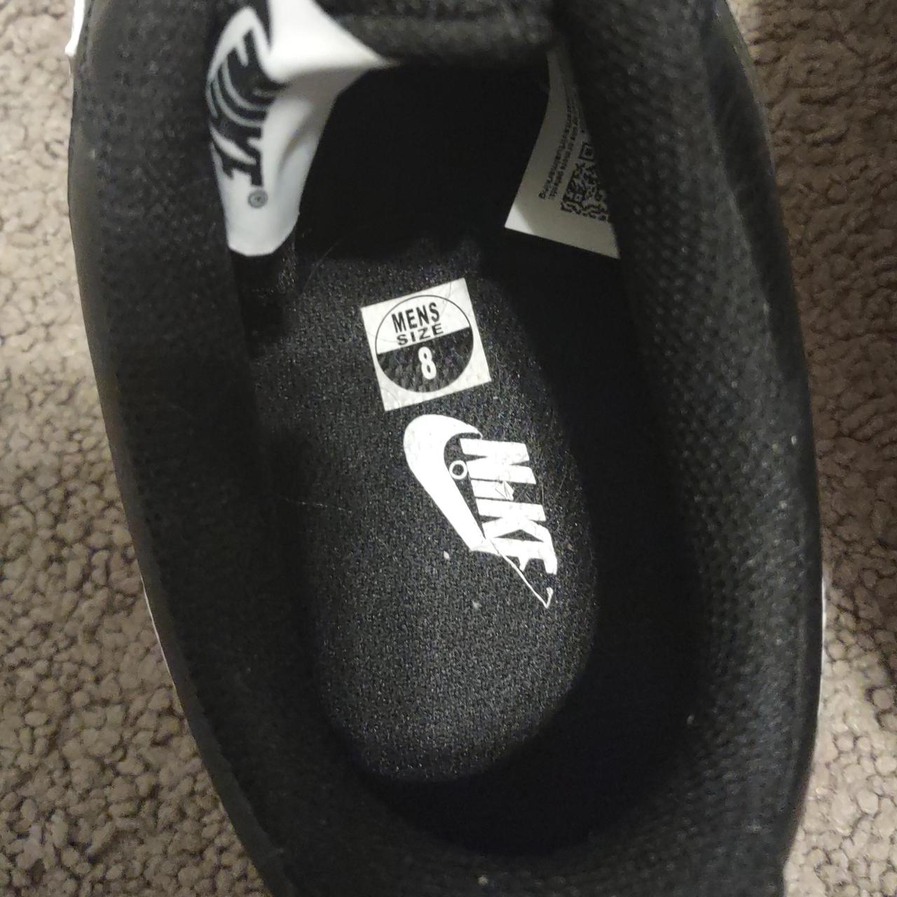 half white half black nike shoes
