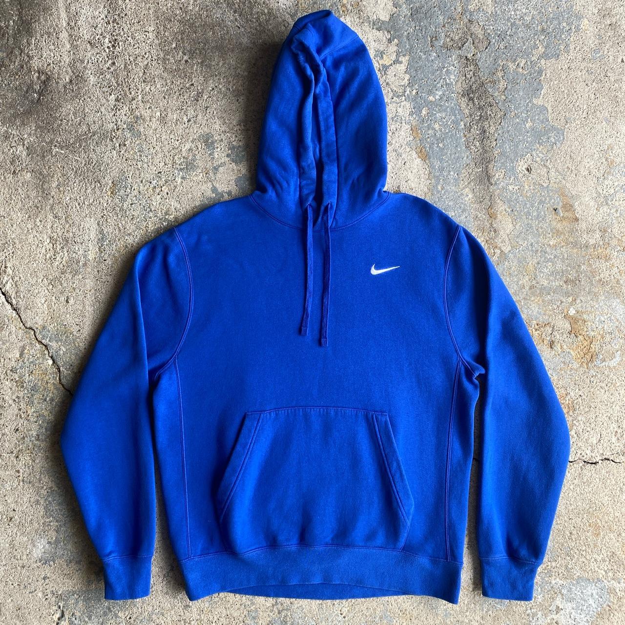 white nike hoodie with blue swoosh