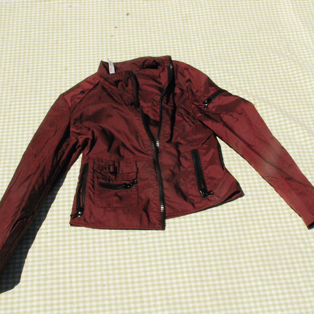 MIU MIU BURGUNDY ASYMMETRICAL ZIPPER JACKET, retails...