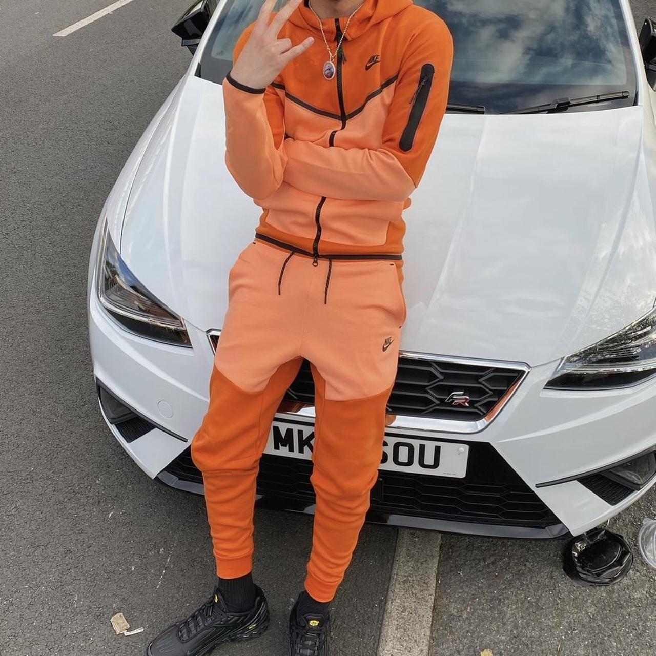nike tech suit orange