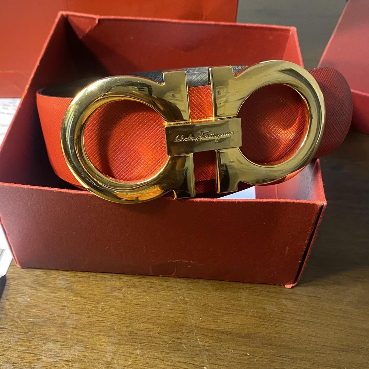 Red and black Ferragamo belt with gold buckle