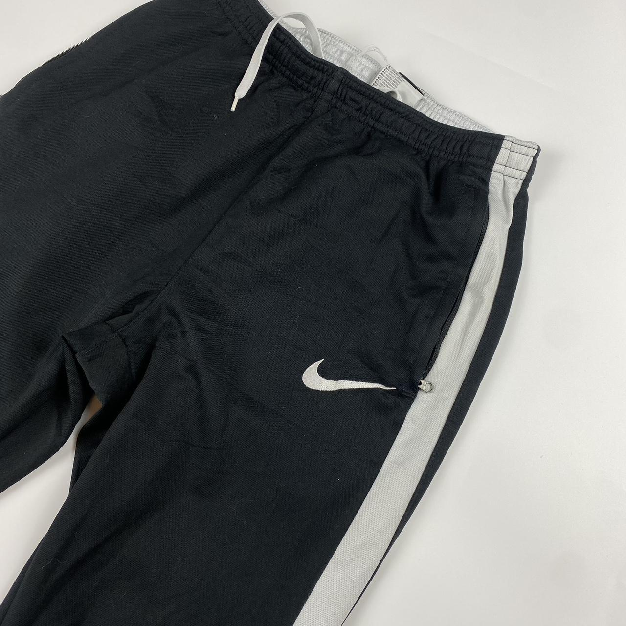 Nike black joggers size small, White stripe,