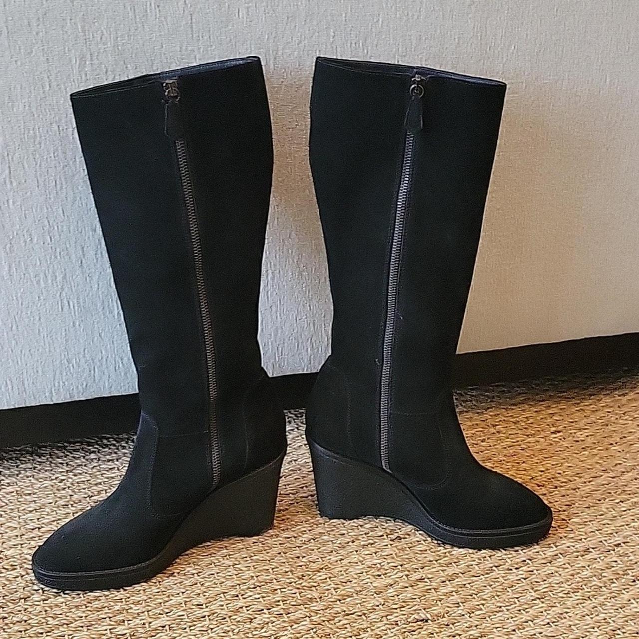 This is a pair of thick black suede boots made Depop