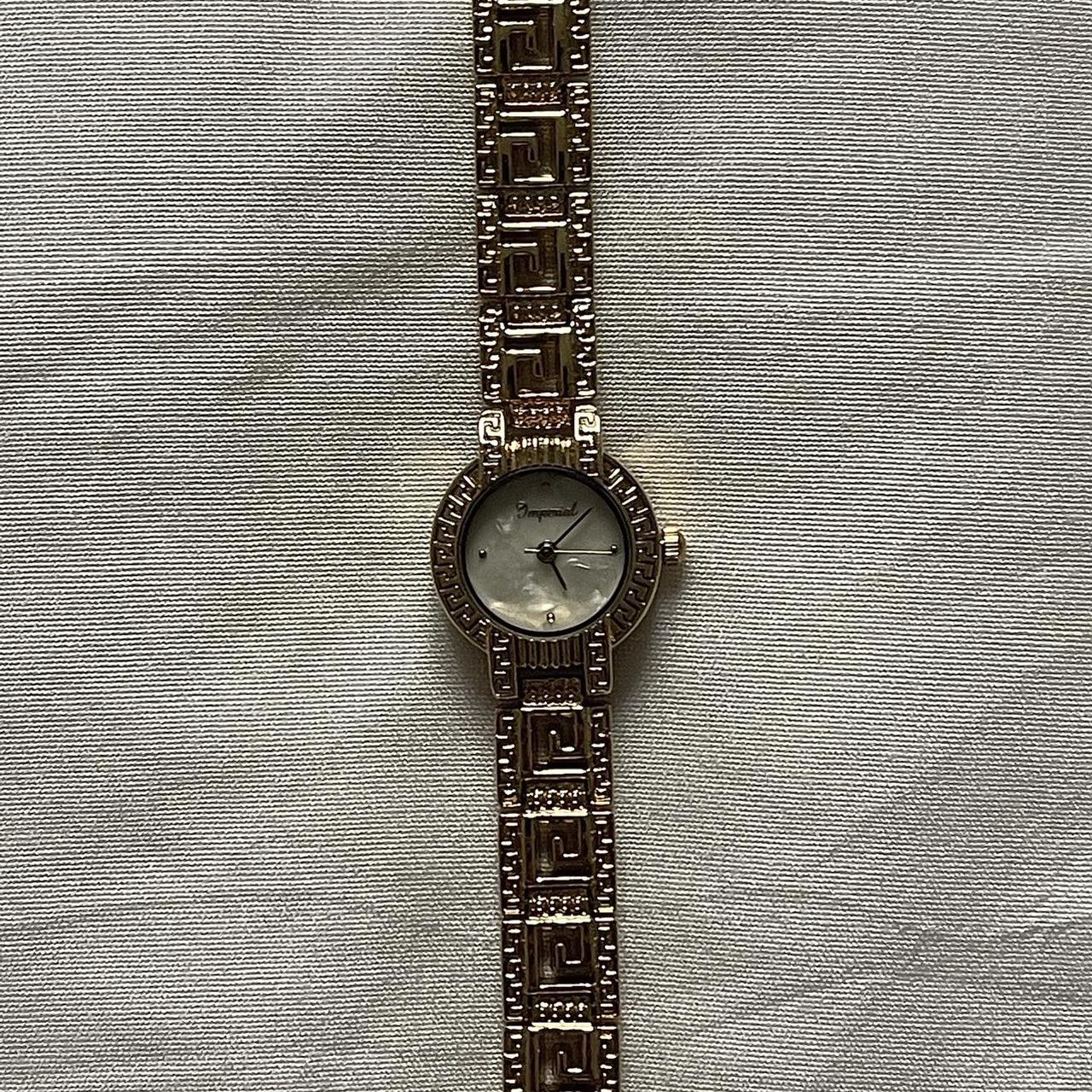 Gold vintage watch with designs and a pearl face Depop