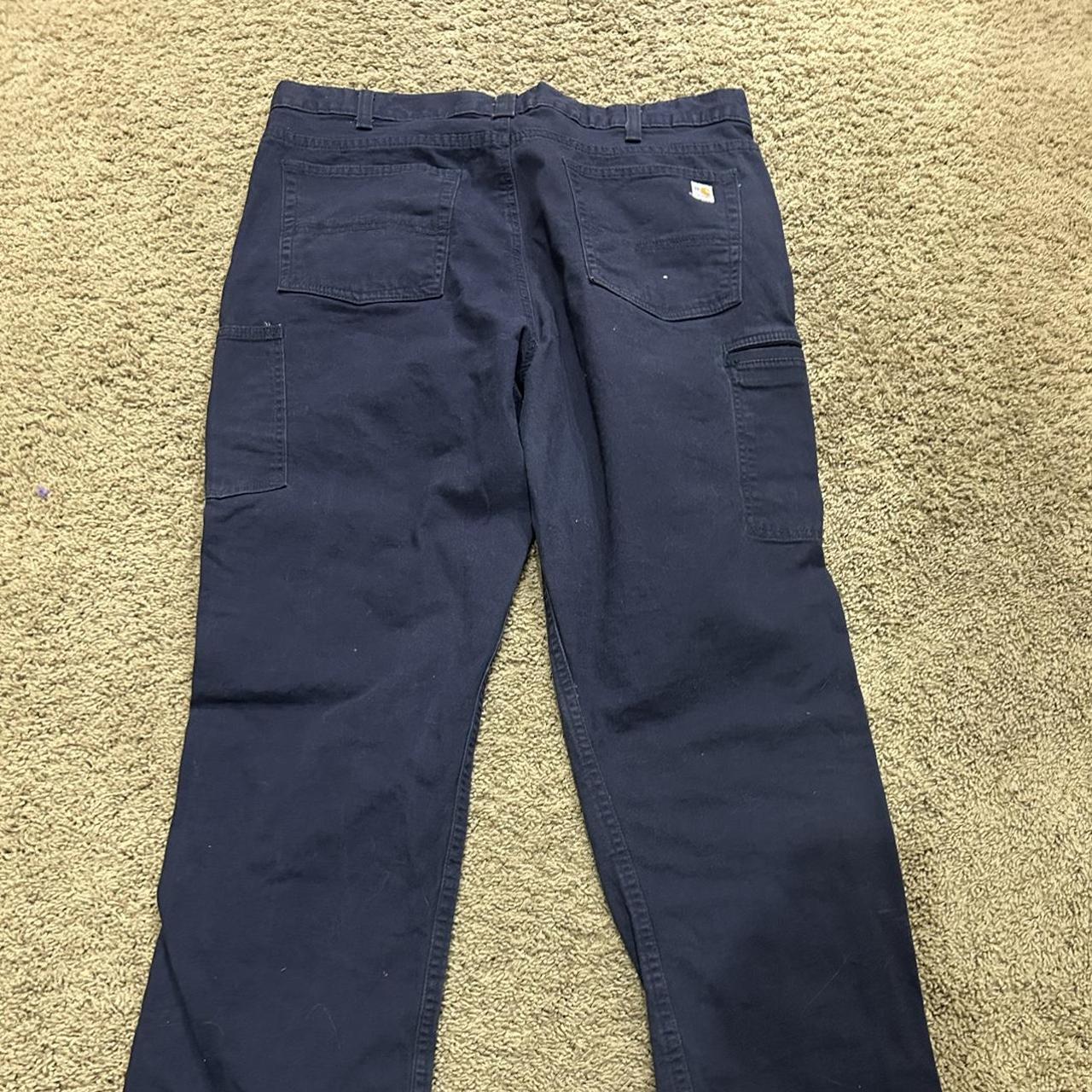 Carhartt pants doesn’t say size but I think it’s a... - Depop