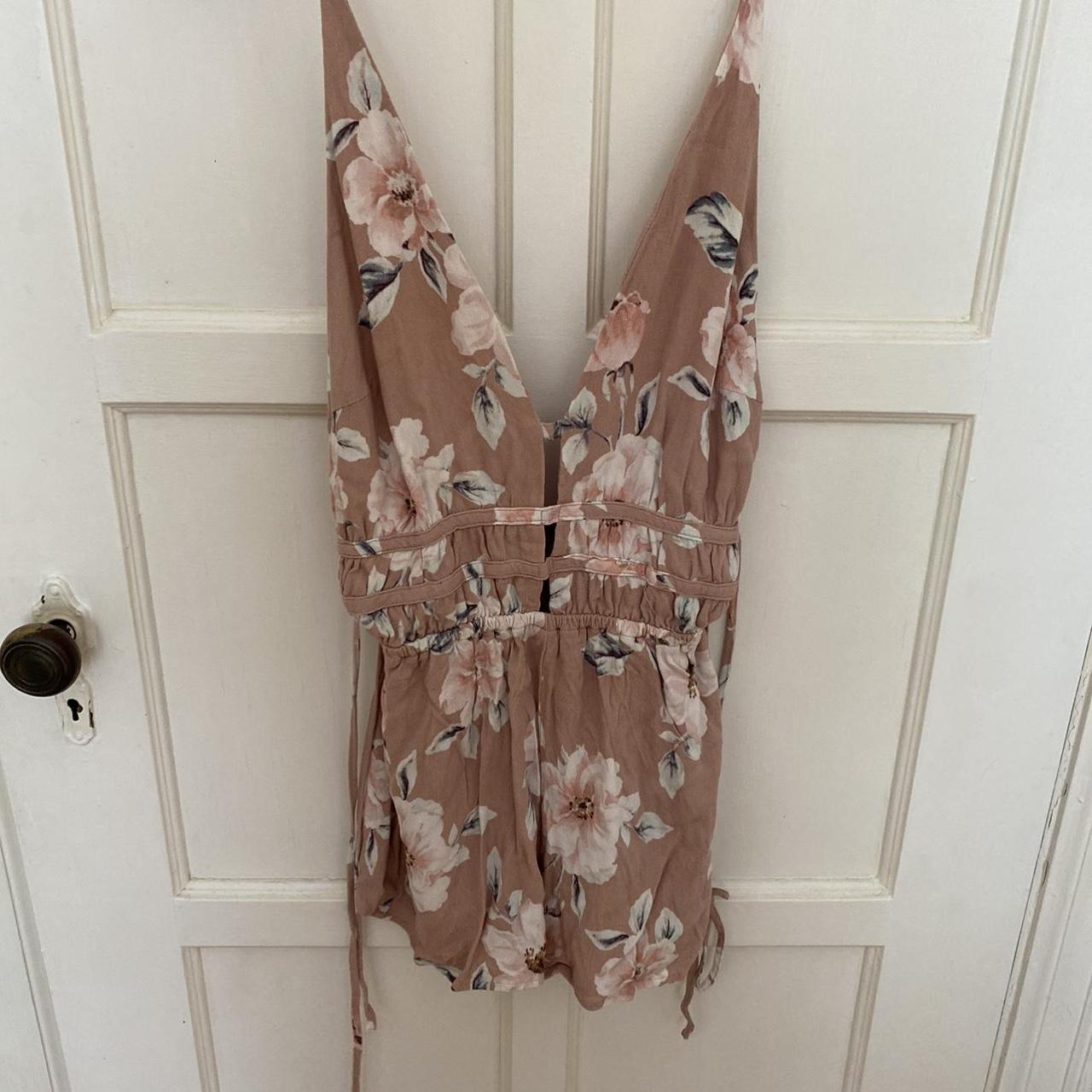Very cute light pink romper with floral pattern.... - Depop