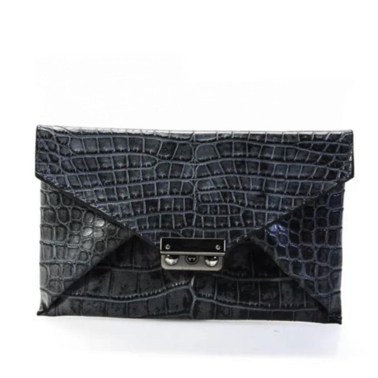 Raven Kauffman 1,400 gray leather envelope clutch.... Depop