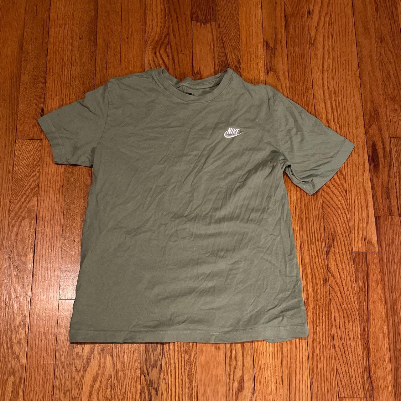 white and olive green nike shirt