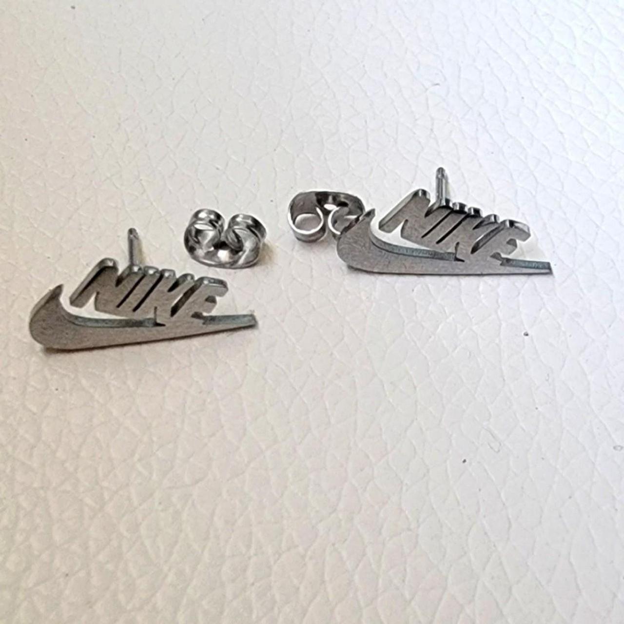 Brand New pair Nike Swoosh earrings. Gorgeous