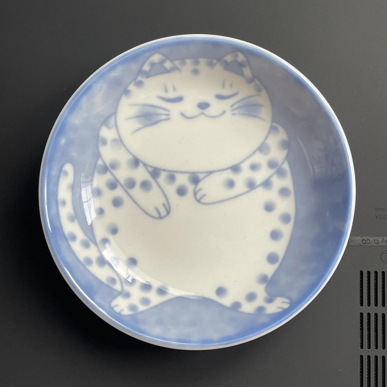 Curled light spotted cat ceramic dish. The dish is... - Depop