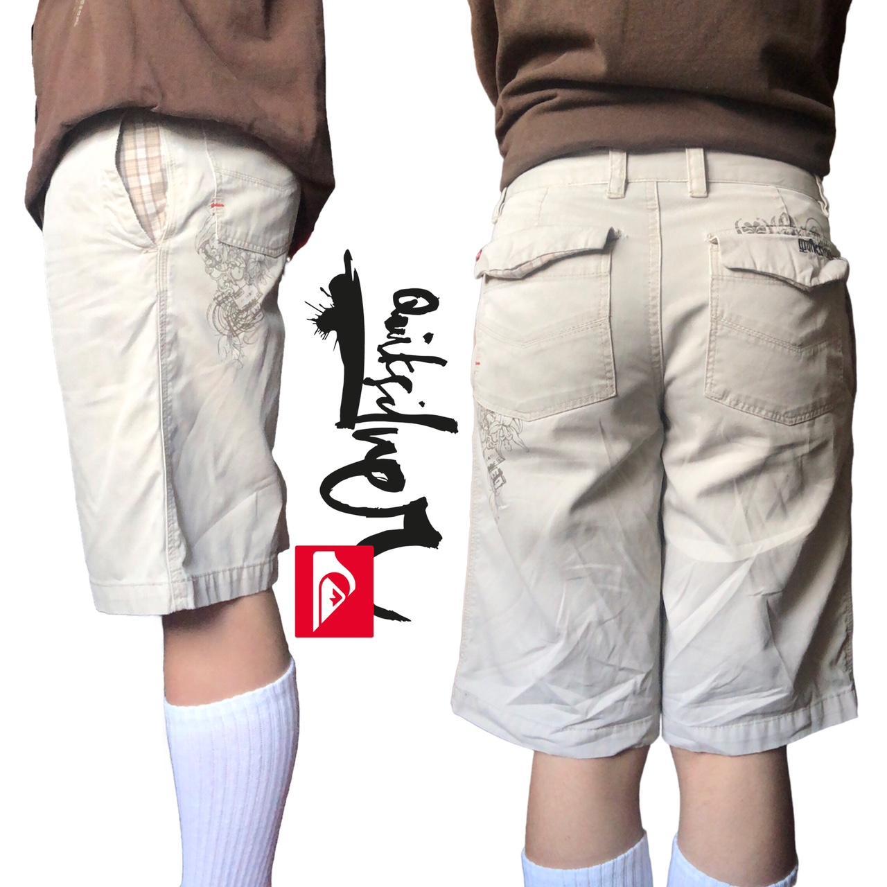 modern 2010s quiksilver cream cargo shorts with