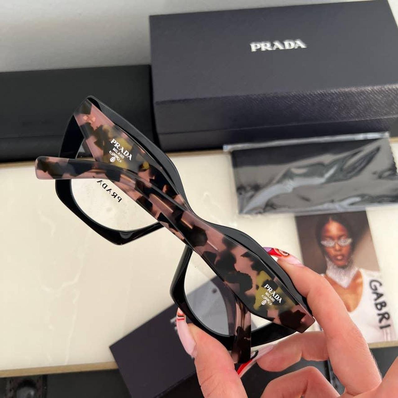 Prada Women's Black and Pink Sunglasses | Depop