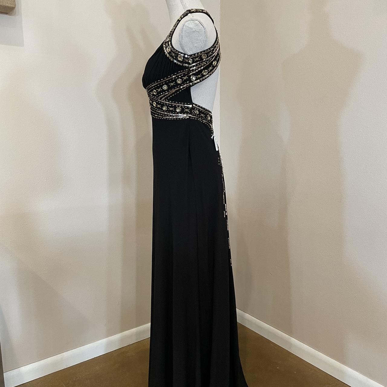 Black and gold prom dress Features an open back and