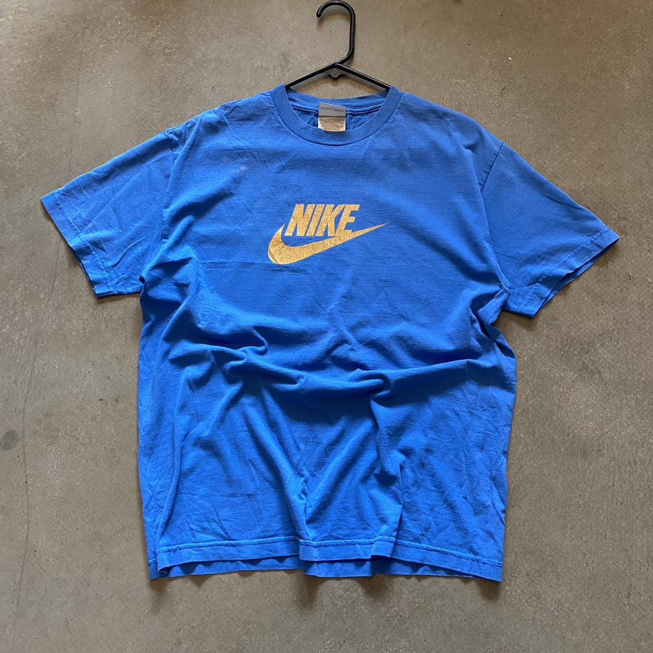 royal blue and yellow nike shirt