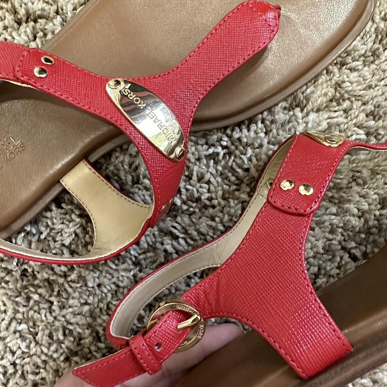 Red with gold Michael Kors sandals. Has wear but