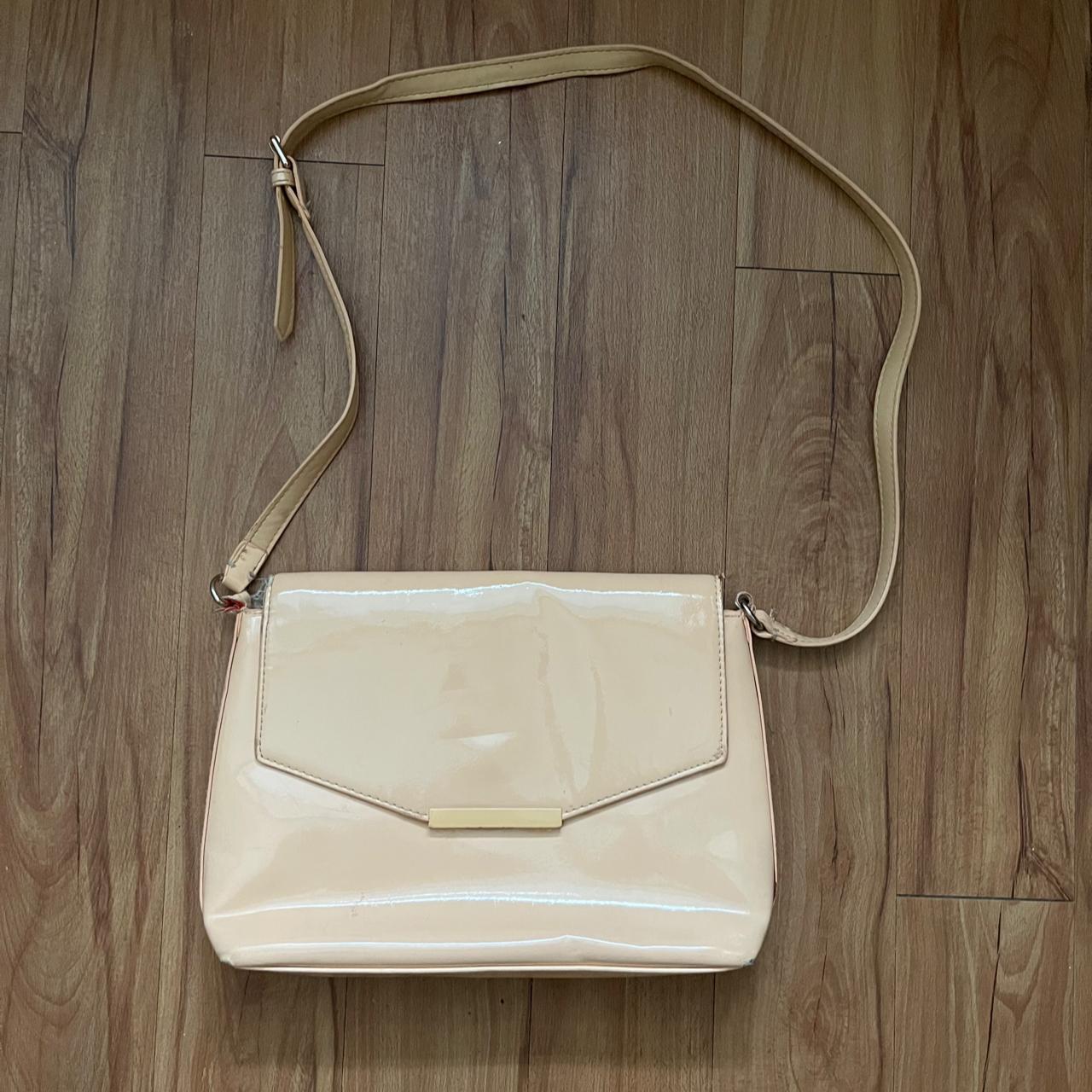 Medium size beige/nude DKNY bag. Used a few times - Depop