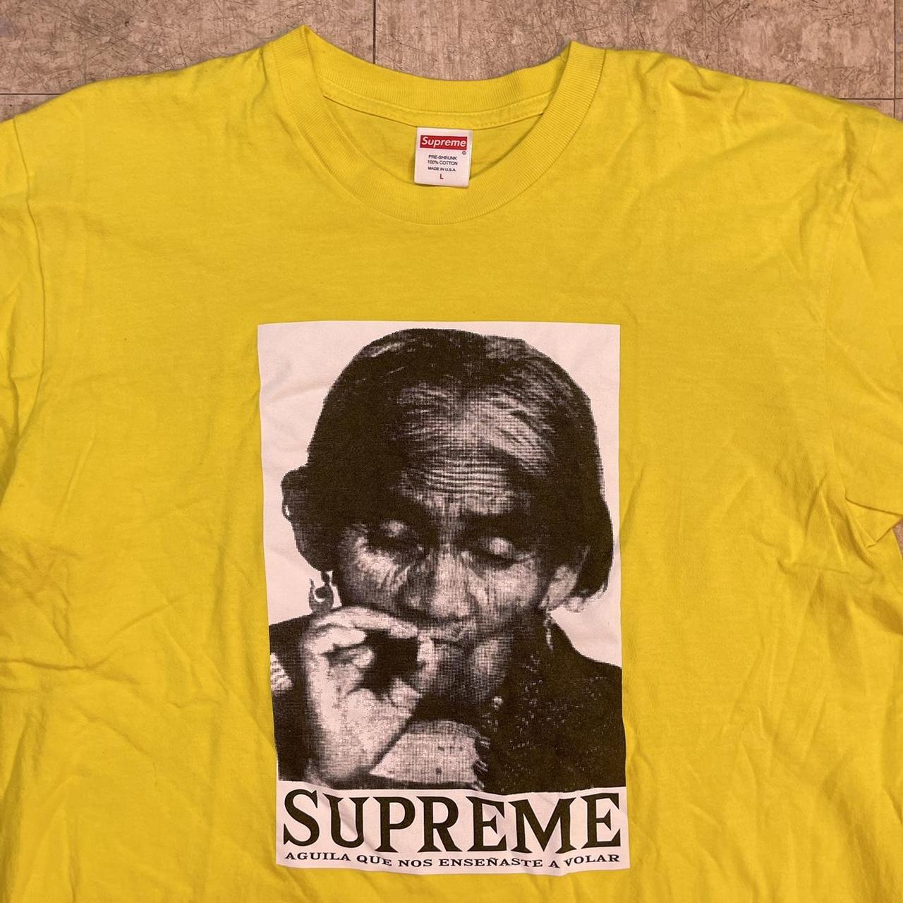 Black and store yellow supreme shirt