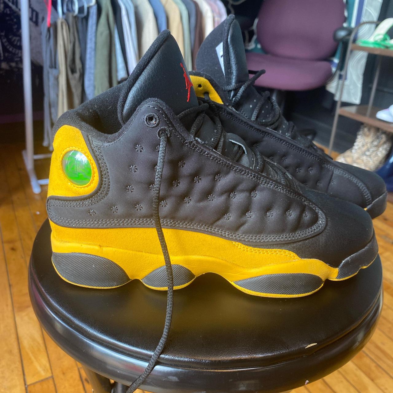 Jordan retro 13 black yellow on sale