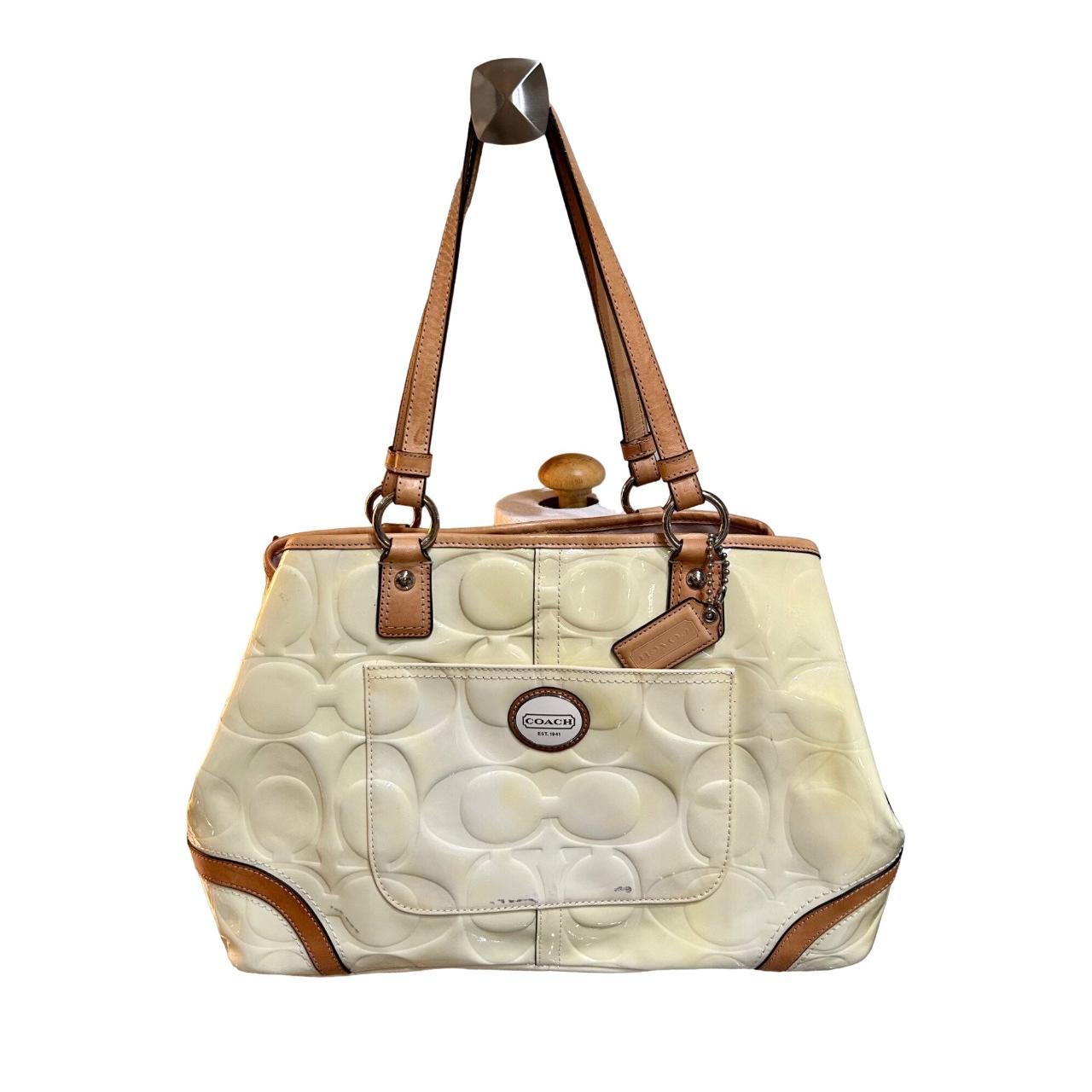 Coach Light Yellow handbag does have a couple... Depop