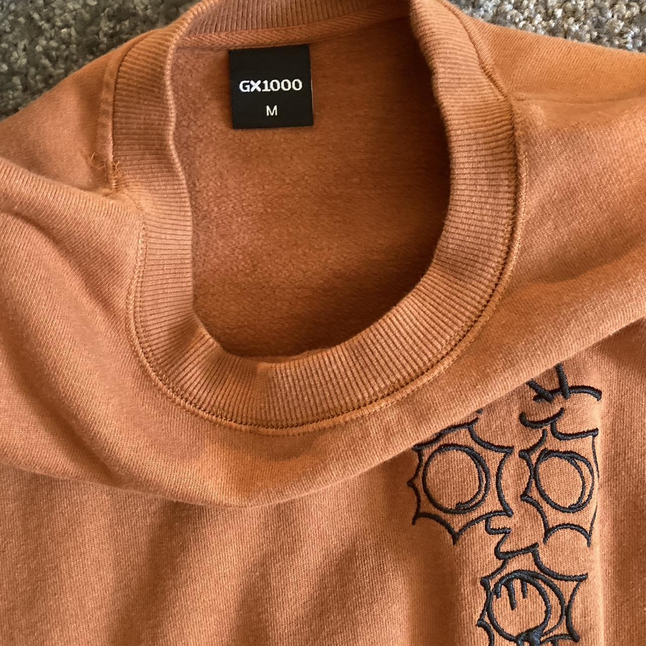 gx1000 orange crewneck sweater size... - Depop