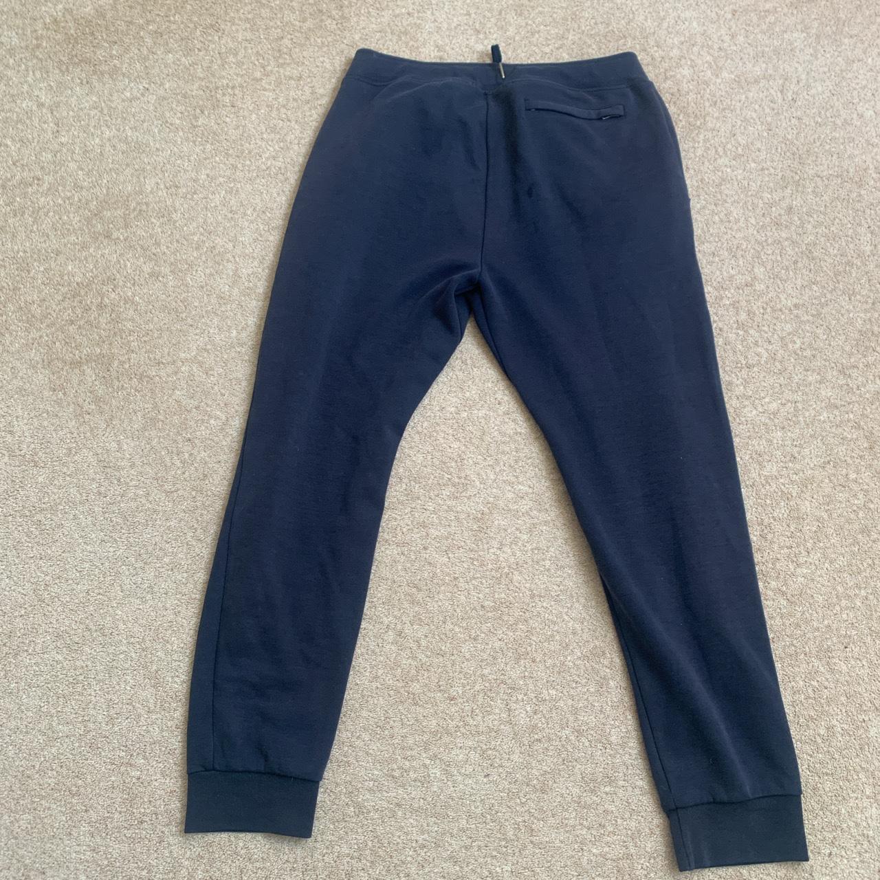 Dark blue Ralph Lauren joggers, small hole on the... - Depop