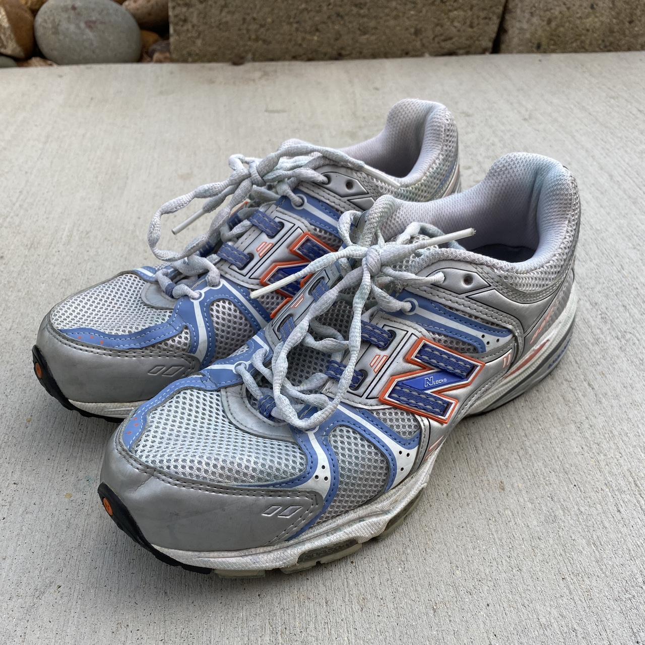 New Balance 850 in a metallic blue and orange color