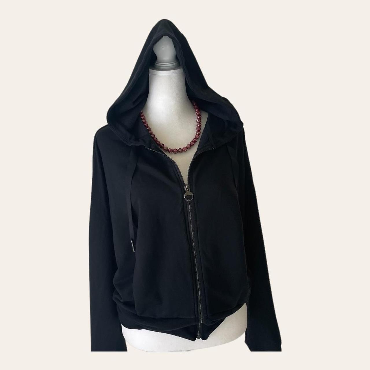 Black Athleta zip up hoodie with character. This... Depop