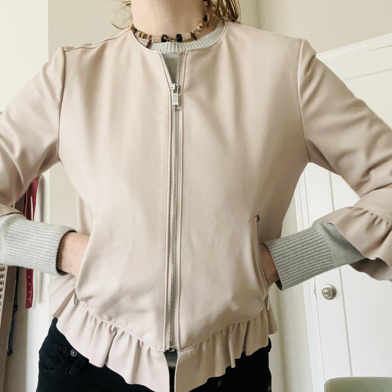 Soft vegan leather short jacket with ruffle details...