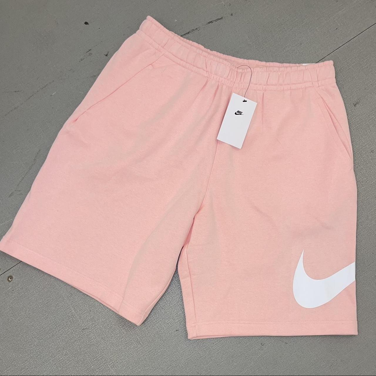 Pink and white nike shorts on sale