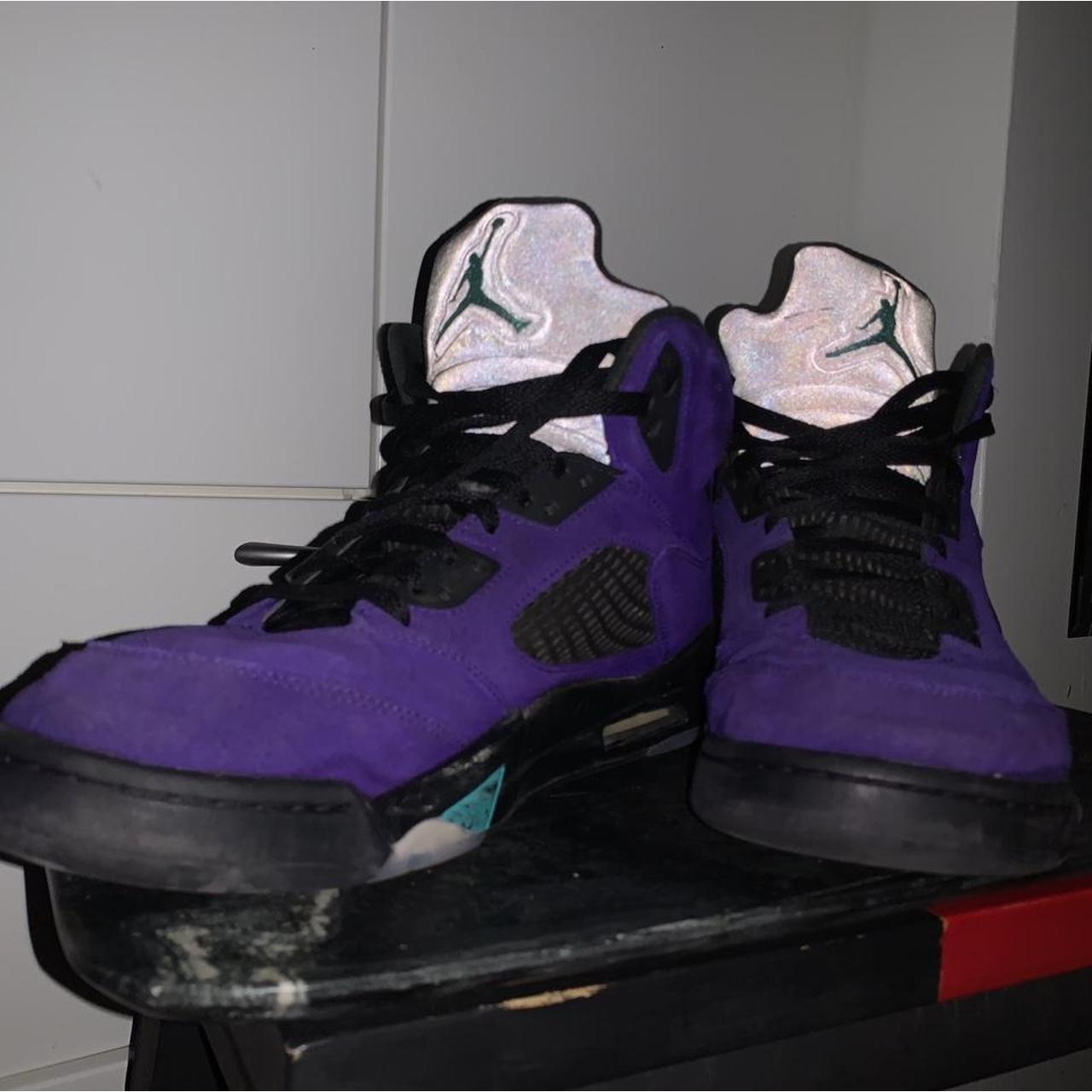 black jordans with purple tongue
