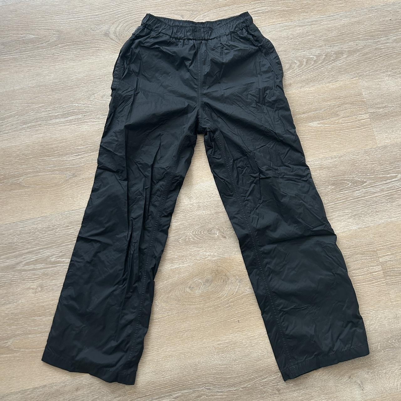 Black waterproof trousers with elasticated waist and... - Depop