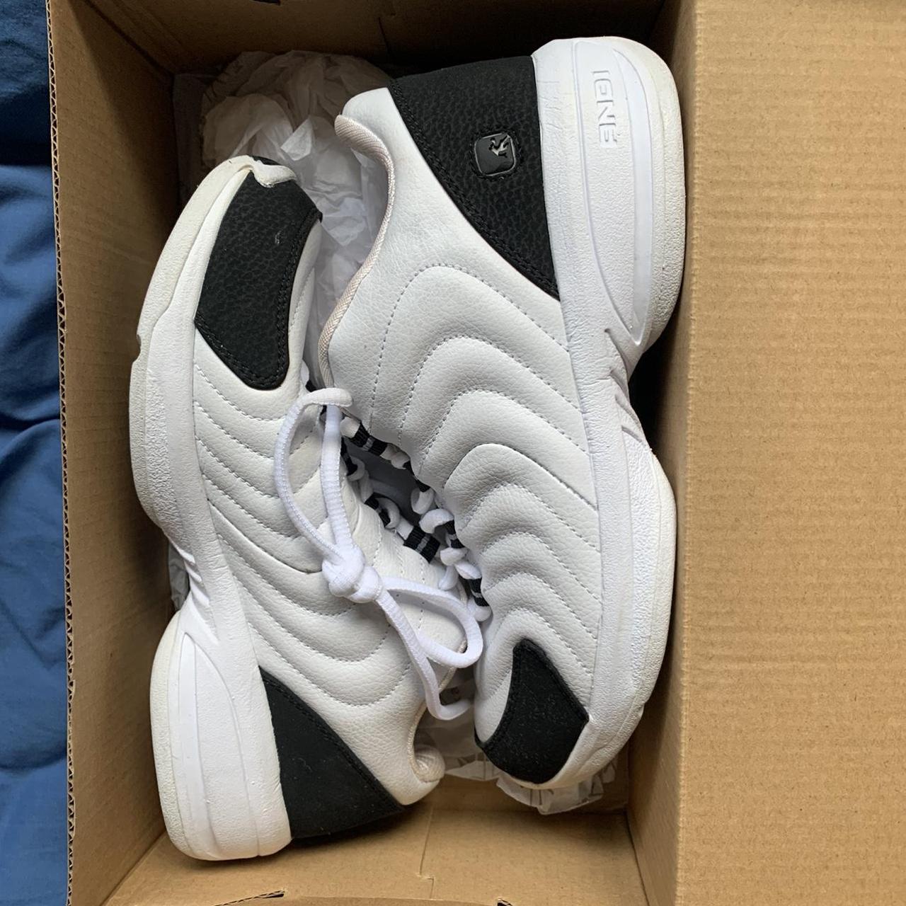 white & black reposto trainers