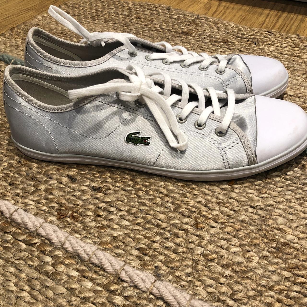 Silver Lacoste trainers worn once. Slight marks... - Depop