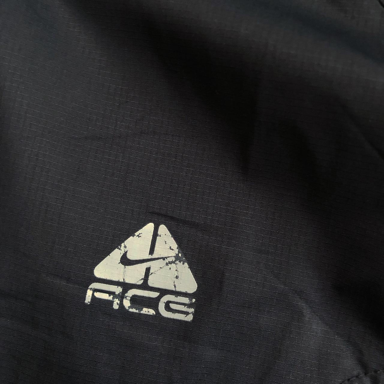 Nike ACG jacket in black with hood, print logo and... - Depop