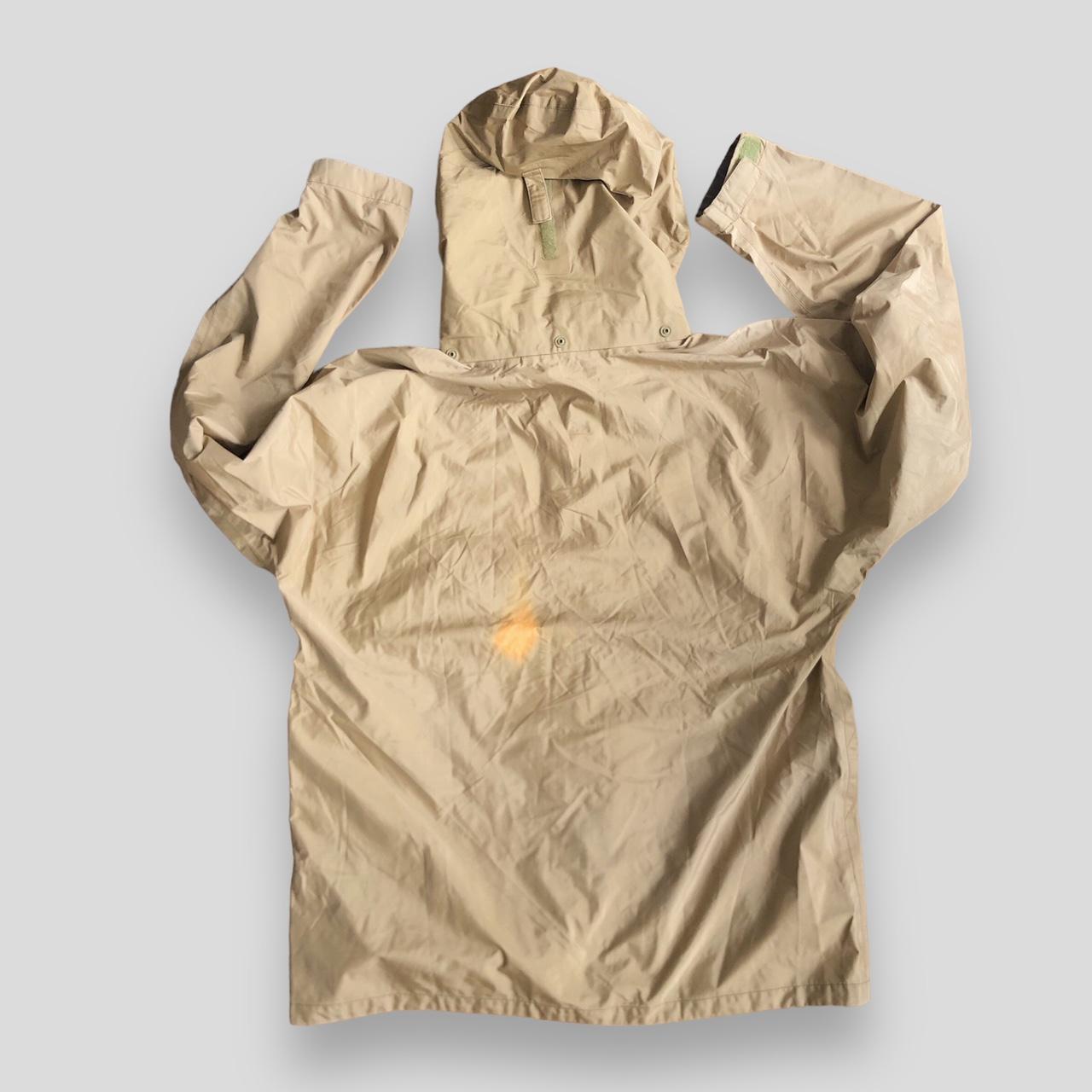 Montbell GoreTex jacket in gold/beige. Hooded jacket...