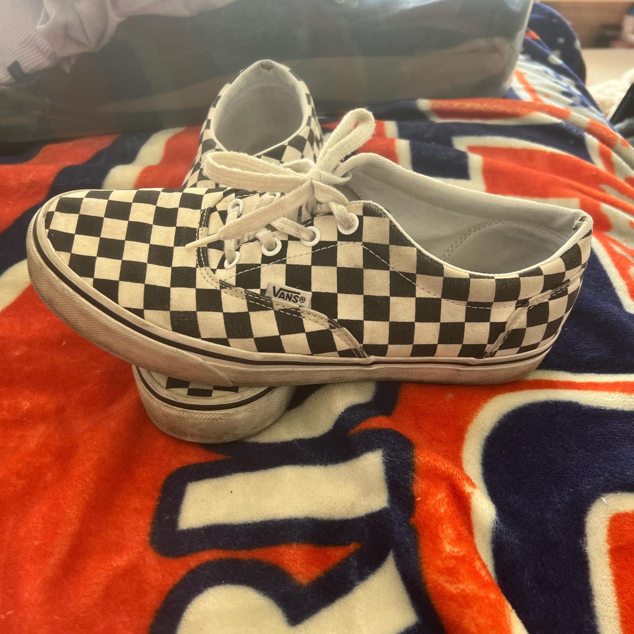 Vans checkered white and black small rips in the. Depop