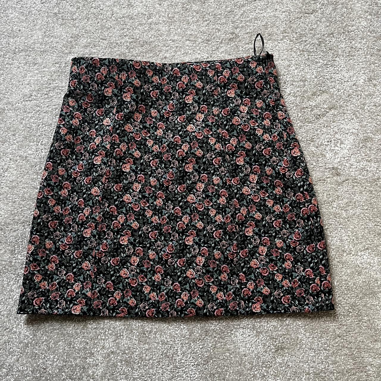 high waisted black mini skirt with a pink floral... - Depop