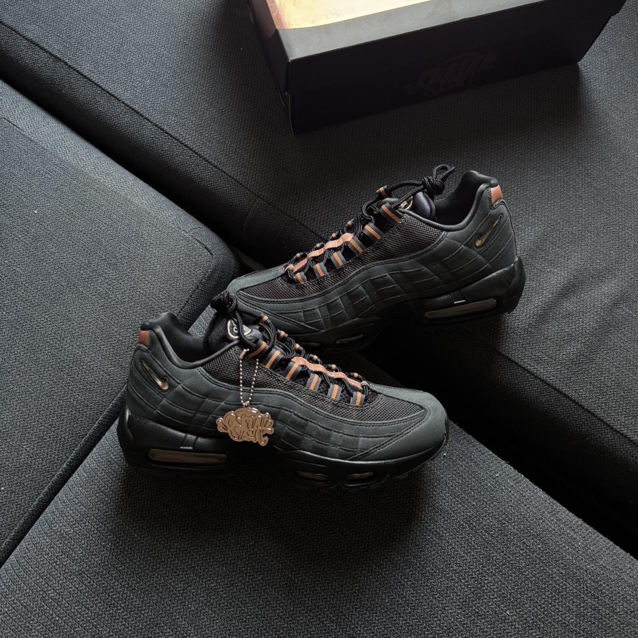 black and bronze nike shoes